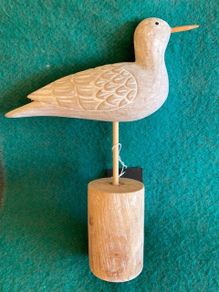 Hand crafted bird on timber perch. New