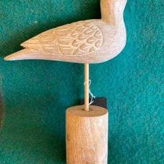 Hand crafted bird on timber perch. New