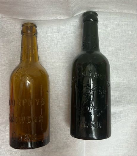 Antique Cork Advertising Bottles x2