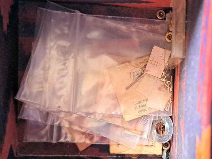 Boxes of miscellaneous watch parts