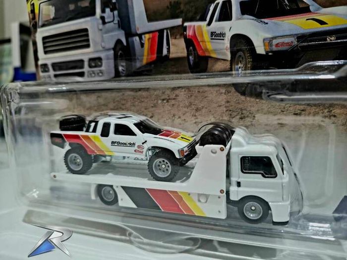 Hotwheels Toyota Off Road Truck with Fleet Street transporter.