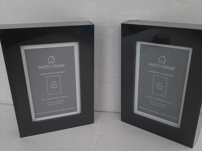 2 new wooden photo frames in wrapping