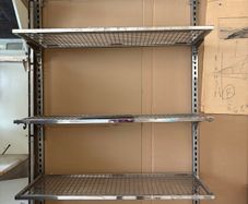 commercial-grade, wall-mounted twin-slot wire shelving system featuring adjustable chrome or galvanized steel mesh shelves.
