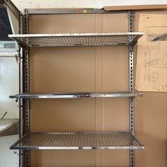 commercial-grade, wall-mounted twin-slot wire shelving system featuring adjustable chrome or galvanized steel mesh shelves.