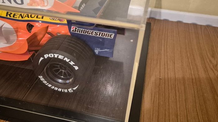 A 1:6 scale (32 inches long Formula 1 car) limited edition model of the 2007 Season ING Renault R27 F1 Team car