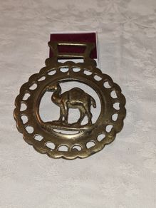 Antique solid brass camel medallion