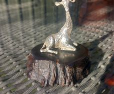 Sterling silver giraffe on Zimbabwean wood, by Patrick Mavros, D18 post 8e