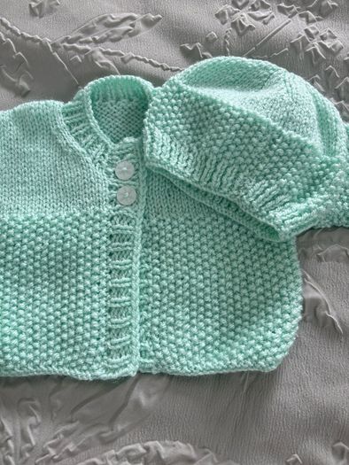 hand knitted baby blankets and cardigans