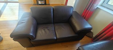 2 brown leather sofas