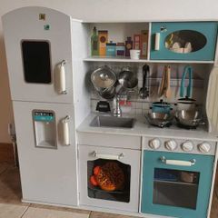 Wooden play kitchen with accessories