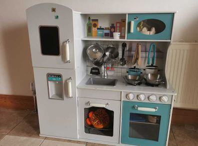 Wooden play kitchen with accessories