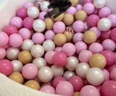 Luxury cream bouche ball pit with pink, white and gold balls