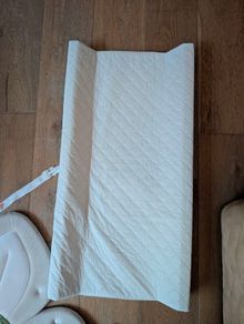 baby changing mat, bib and bath flower