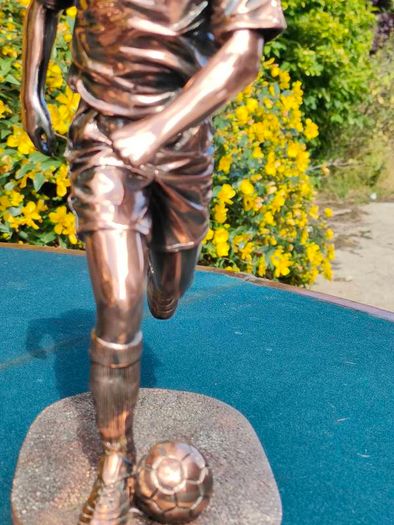 Two Gilded footballers