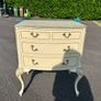 Vintage Olympus cream and gilt Louis style chest of drawers featuring bow-front drawers and cabriole legs. Image 4