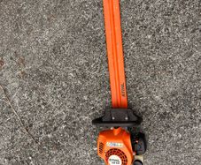 STIHL HS 45 petrol hedge trimmer with 24-inch double-sided cutting blade.
