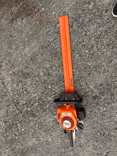 STIHL HS 45 petrol hedge trimmer with 24-inch double-sided cutting blade.
