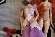 4 barbie dolls