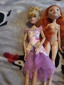 4 barbie dolls