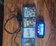 PlayStation vita with four games and a 4gb memory card