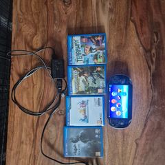 PlayStation vita with four games and a 4gb memory card