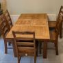 Extendable oak table with 5 matching chairs Image 2