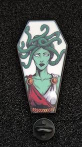 Medusa,  pin back badge.