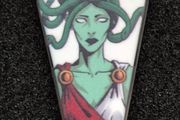 Medusa,  pin back badge.