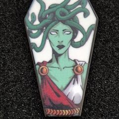 Medusa,  pin back badge.