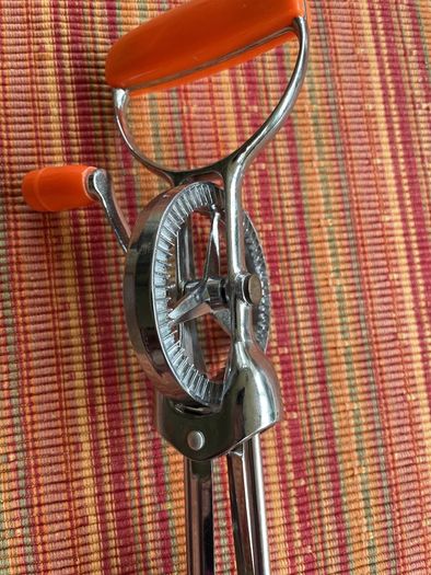 Vintage whisk , steel with orange bakelite handle