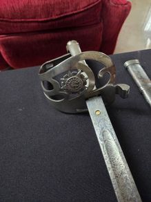 Irish Army sword with Nickle plate guard .
