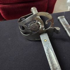 Irish Army sword with Nickle plate guard .