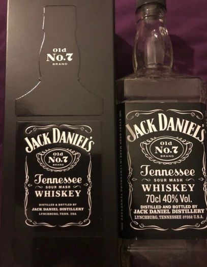 Jack Daniels whiskey empty bottle and box