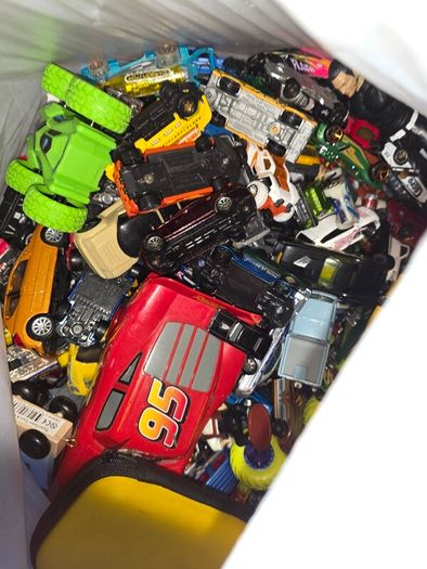 big bag of cars and a few wrestlers