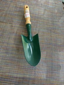 Vintage garden trowel with wooden handle