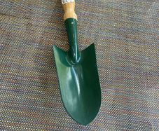 Vintage garden trowel with wooden handle
