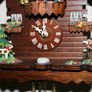 Wall Clock - the figures in the upper part of the clock are constantly moving - in working order Image 3