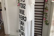 long tunic with side slits Bnwt.  Short sleeve white with black logo