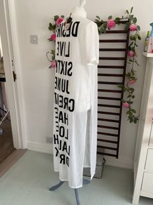 long tunic with side slits Bnwt.  Short sleeve white with black logo