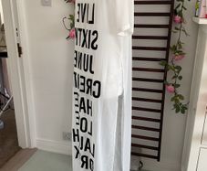 long tunic with side slits Bnwt.  Short sleeve white with black logo