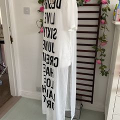 long tunic with side slits Bnwt.  Short sleeve white with black logo