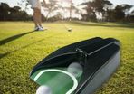 Golf putt return machine