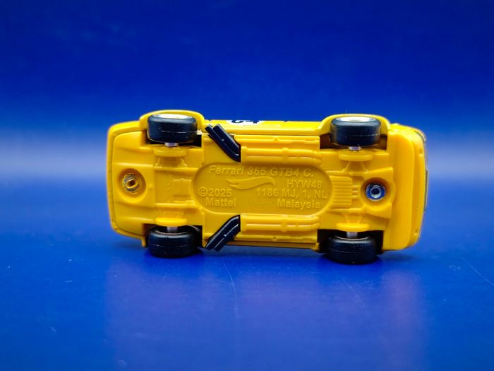 Hot Wheels Ferrari 365 GTB4 C with custom wheels.