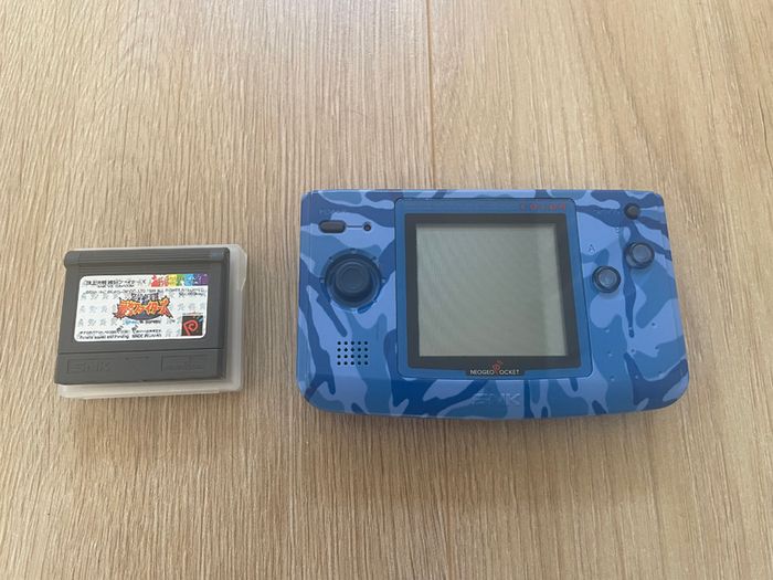 Neo Geo Pocket Color with game SNK vs. Capcom: Match of the Millennium