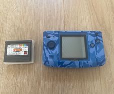 Neo Geo Pocket Color with game SNK vs. Capcom: Match of the Millennium