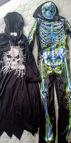 Two Halloween skeleton costumes