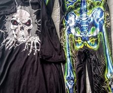 Two Halloween skeleton costumes 7-10 and 10-12 years
