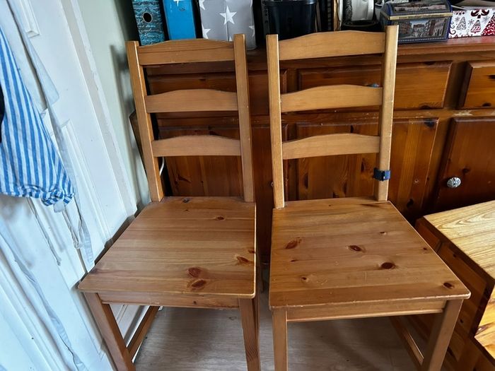two wooden dining chairs