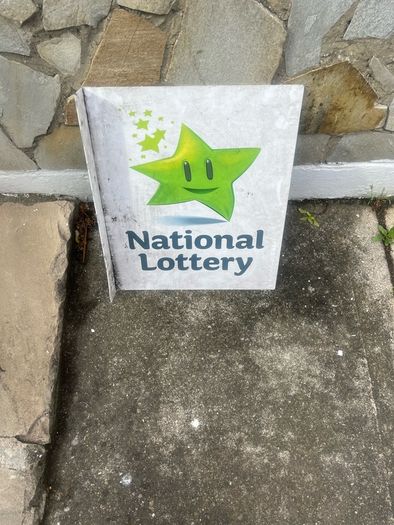 Double sided national lottery wall sign.