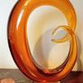 Pair of Mid - Century Murano Amber Glass Love Knot Sculpture. Image 3